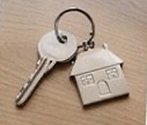 House keys on a ring with a little house-shaped keychain