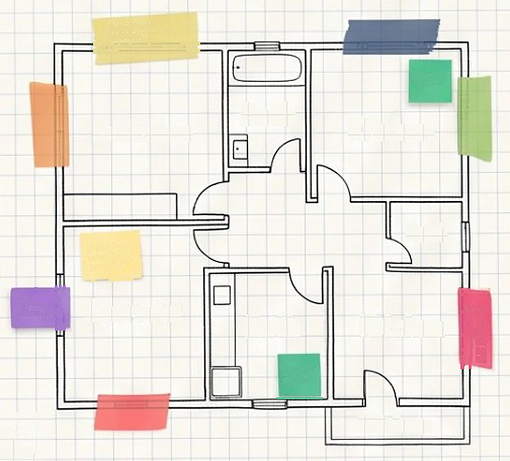 Hand-drawn floor plan of a rented flat with coloured sticky notes on the rooms
